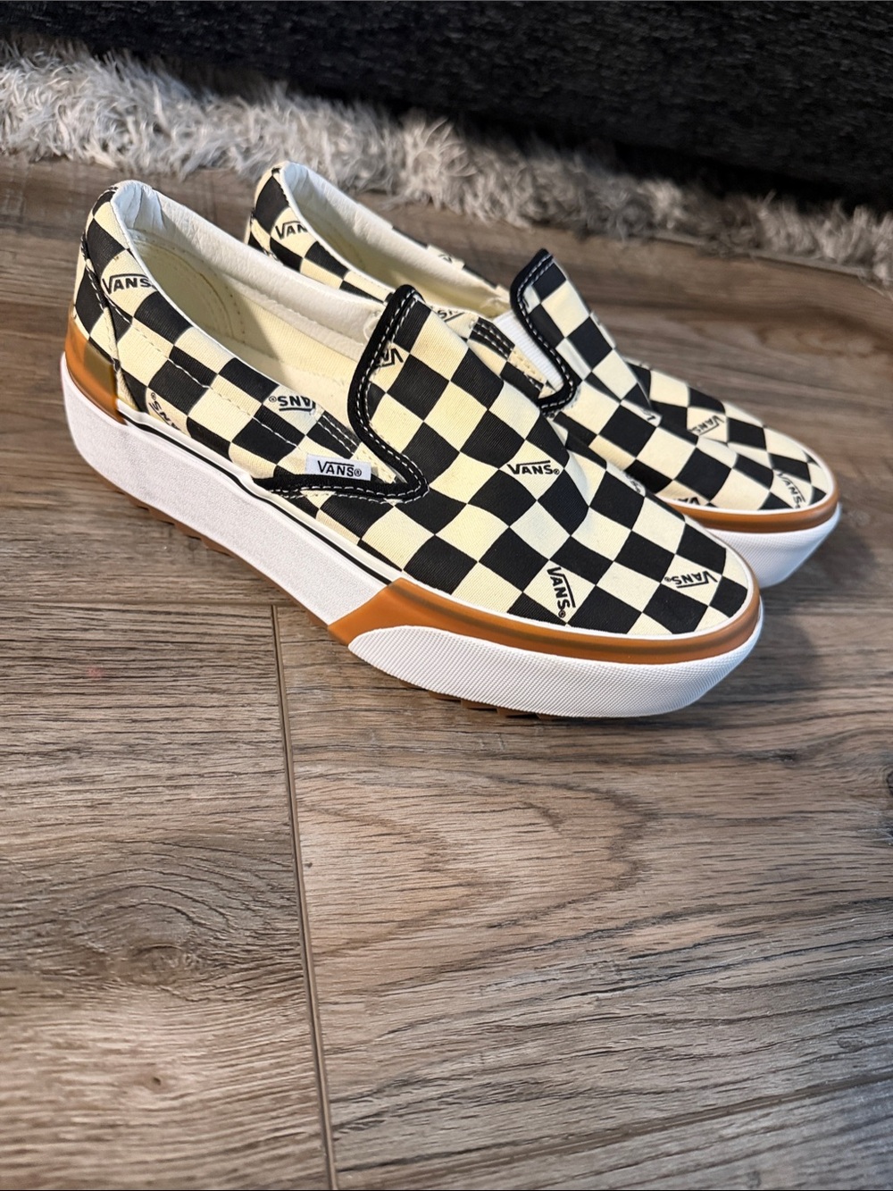 Vans Checkerboard Platform Slip-On Sneakers in Black and Cream with Brown Accent
